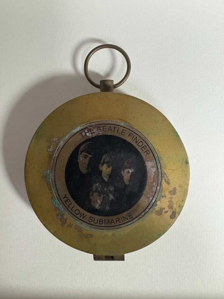  closed vintage brass Beatle Finder compass with Beatles portrait
