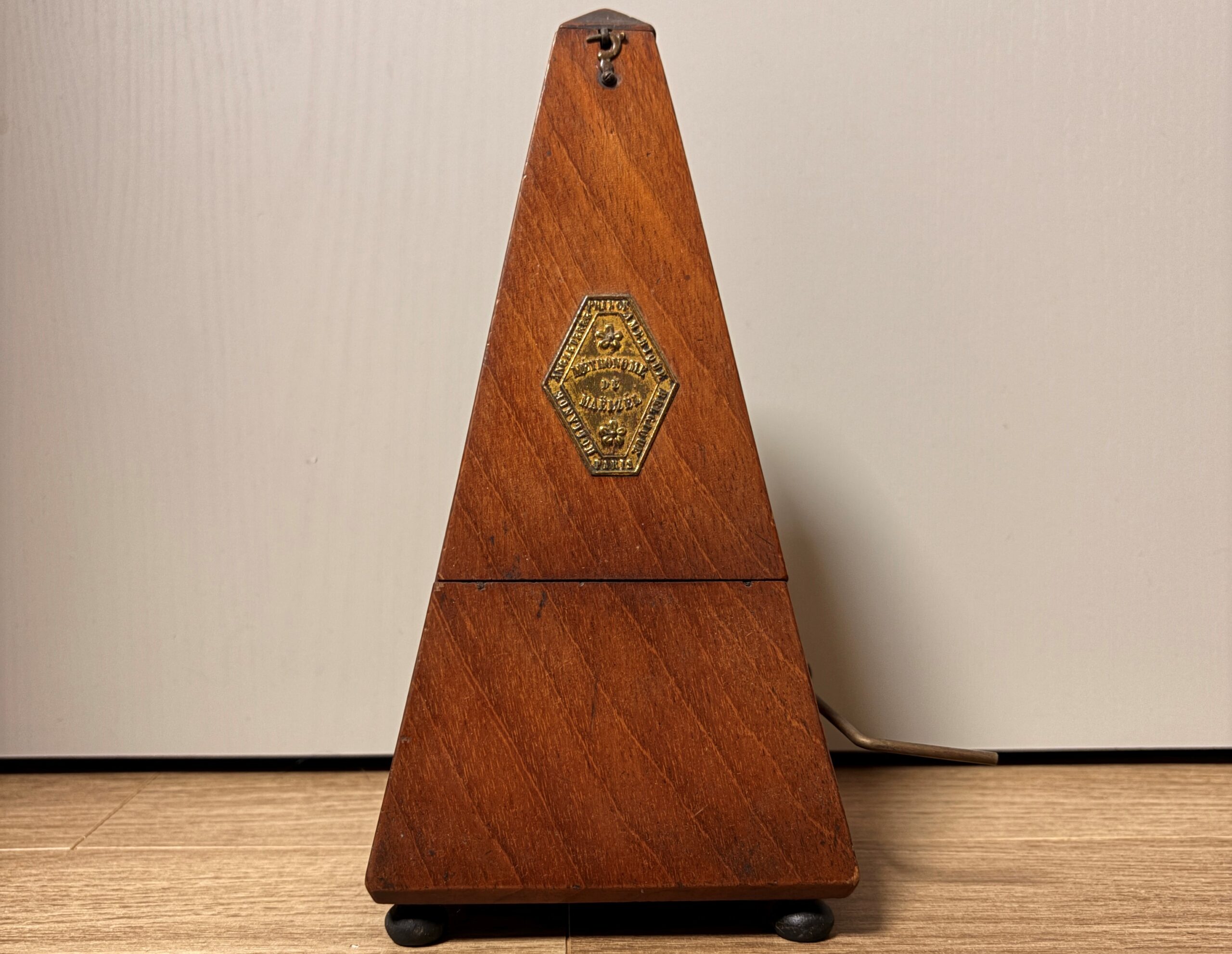 wooden metronome on floor