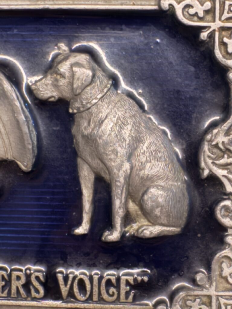 close-up of Nipper listening attentively to a gramophone